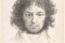 drawing of a man with wild curly hair staring downward